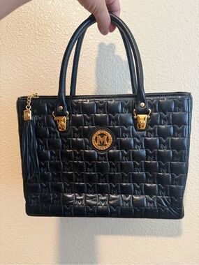 Metrocity Black Quilted Satchel with Gold Emblem and Tassel